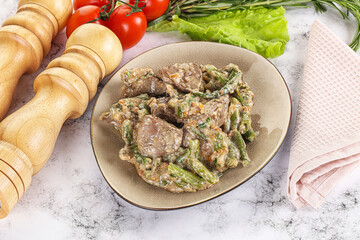 Fried turkey liver with herbs in cream sauce