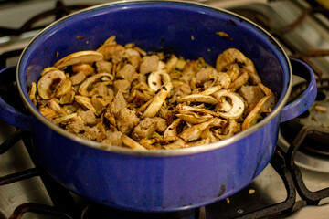 a bowl of cooked mushrooms,