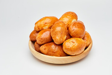 Golden-brown homemade pastries with a glossy crust, perfect for breakfast or a sweet snack