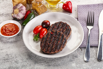 Grilled burger cutlet with sauce