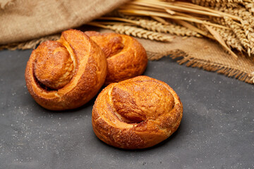 Freshly baked cinnamon roll with a golden crust and a sprinkle of sugar, perfect for a sweet treat