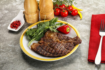 Grilled chuck roll steak with arugula