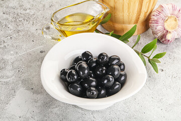 Black olives with oil and branch