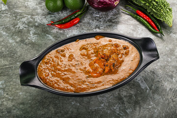 Indian cuisine - chicken curry with spices
