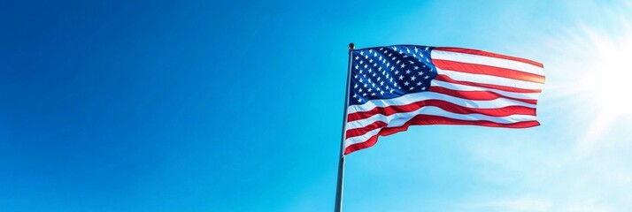 Obraz premium Patriotic Tribute: American Flag Waves Gracefully at a Military Cemetery on National Holidays, Honoring Heroes on Veterans Day and Memorial Day.