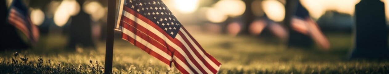 Patriotic Tribute: American Flag Waves Gracefully at a Military Cemetery on National Holidays, Honoring Heroes on Veterans Day and Memorial Day.