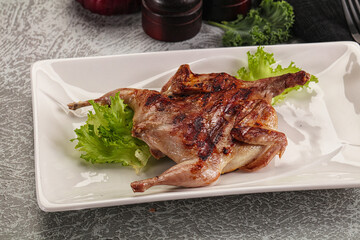 Grilled quail in the plate