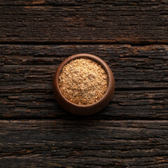 Soy fiber to cleanse the colon with psyllium in the bowl - Rustic wooden background