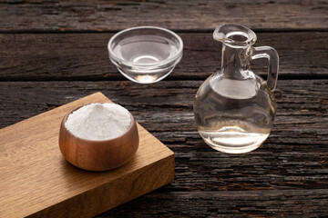 Vinegar and baking soda mix in a glass bowl.