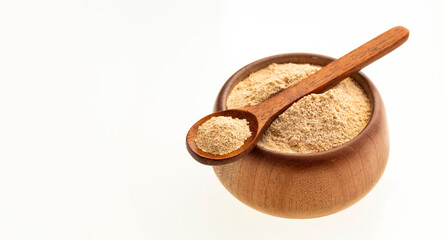 Maca root or Peruvian ginseng in the bowl and spoon - Lepidium meyenii