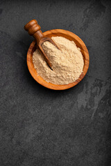 Peruvian organic maca powder - Lepidium meyenii in the bowl and spoon