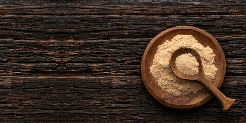 Peruvian organic maca powder - Lepidium meyenii in the bowl and spoon