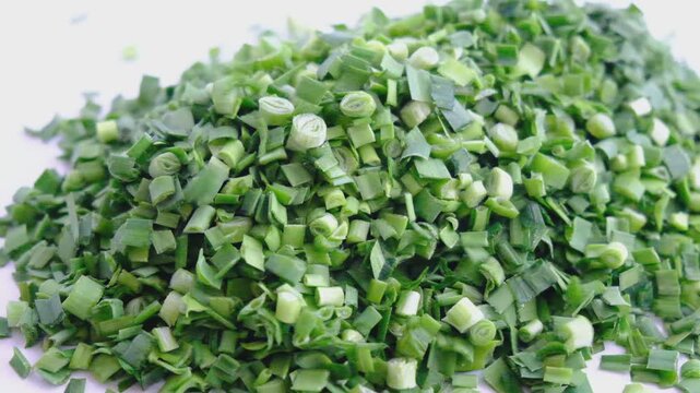 Chopped fresh ripe scallion and garlic on white background. Ingredient salsa	