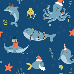 Christmas under the sea seamless pattern. Cute whale, octopus, dolphin, fish, jellyfish and narwhal in Christmas costume. © Viola