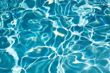 Pool water surface. Blue water texture. Close up blue water surface. Sea surface aerial view. Blue swimming poll water surface. Pattern texture.