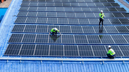 engineer man inspects construction of solar cell panel or photovoltaic cell by electronic device....