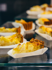 Apple tart or cake on sale in a bar or a coffee shop.