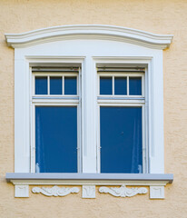 detail of classicistic window at house facade