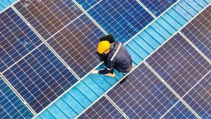 Worker Technicians are working to construct solar panels system on roof. Installing solar...