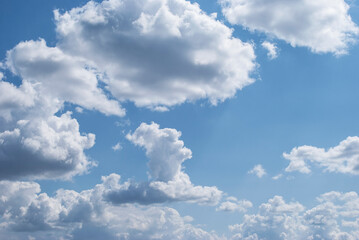 gentle white clouds in the blue sky