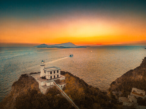 lighthouse of baia, bacoli, monte di procida at sunset, italy