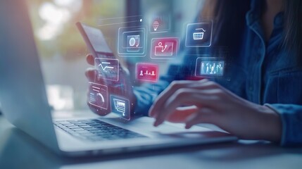 A woman is using a laptop with a screen that shows a lot of icons and a keyboard