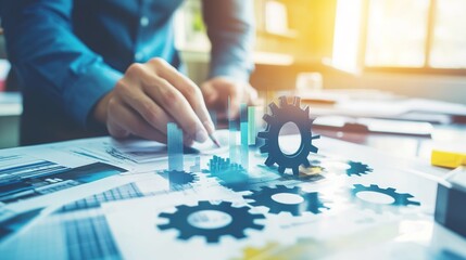 A man is drawing a gear on a piece of paper