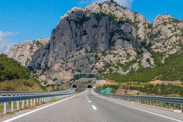 Road leading to the tunnel in the mountains