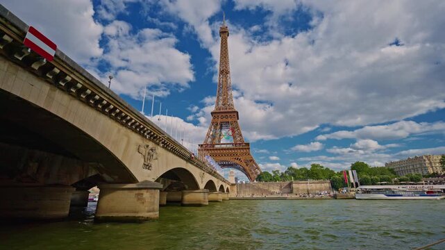 Eiffel tower decorated with Olympic rings for the Olympic games 2024. The Olympic rings installed on the Eiffel Tower with tourists strolling near the Trocadero square Paris, France July 30, 2024