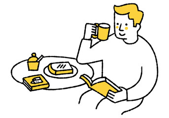 Man reading a book while eating breakfast