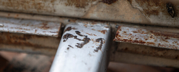 Close up of rusty steel truss for industrial background, selective focus