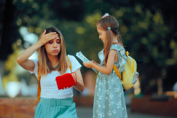 Fototapeta premium Broke Mom Giving Lunch Money to her Kid at School. Sad mother giving all her financial resources for education 