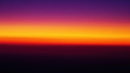 Fiery Horizon: A breathtaking aerial view of a vibrant sunset, with the sky ablaze in a spectrum of orange, yellow, and purple hues. 