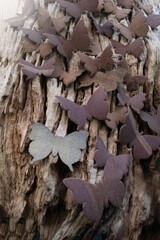 Butterflies made from waste natural materials for natural background.