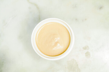 Almond milk Tea served in cup isolated on grey background top view of asian drink