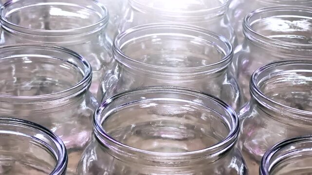Rows of Glass Canning Jars on Store Shelves: Essential Kitchen Storage for Home Preserving | Bulk Food Conservation Supplies and Pantry Organization Solutions for Homemade Preserves