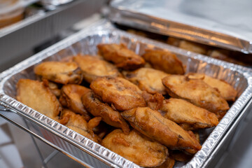 Fried Eggplant in a silver catering container delivered for an event
