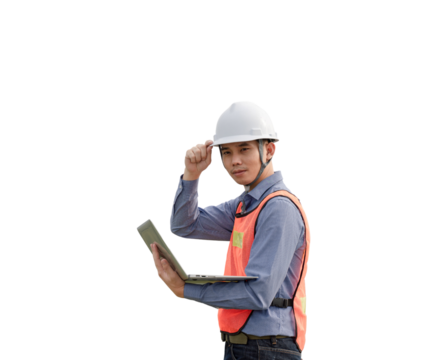 A man wearing a hard hat and safety vest is holding a laptop