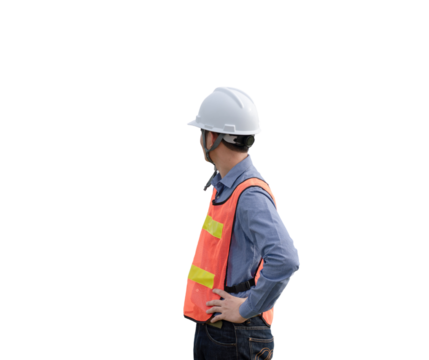 A man wearing a safety vest and a hard hat stands in front of a white background