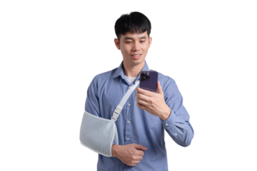 A man with a cast on his arm is taking a picture of himself with his cell phone