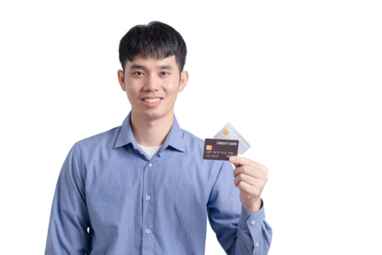 A man is holding a credit card in his hand