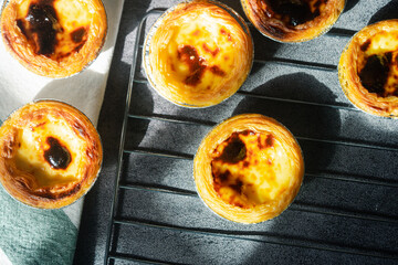 Homemade fresh egg tart dessert freshly baked and cooling on rack