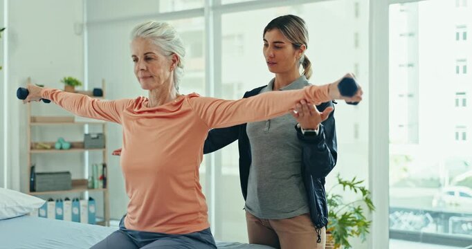 Physical therapy, rehabilitation or old woman doing dumbbell arm exercise, recovery workout or healing client joint pain. Arthritis support, medical patient and physiotherapist test shoulder mobility