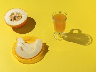 Fresh Melon and Juice on Bright Yellow Background - Vibrant and Refreshing Summer Vibes