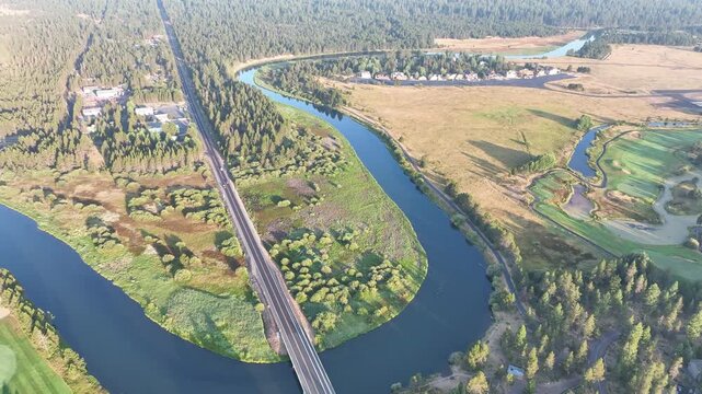 The beautiful Deschutes River winds through the rural landscape near Sunriver, Oregon. This area, in the foothills of the Cascade Mountains, is a popular vacation destination in the summer and winter.