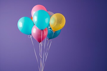 Obraz premium Colorful balloons on a purple background.