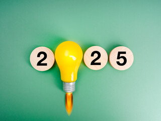 2025 new year innovative trend, business startup concept. 2025 calendar numbers on round wood...