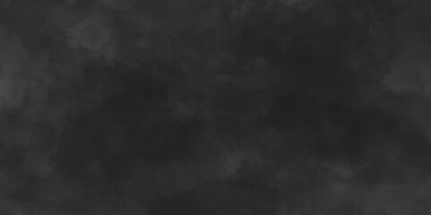 Abstract black watercolor background texture of chaotically mixing puffs of grey smoke on a dark background, beautiful abstract grey cloud on dark black background and colorful texture pattern.