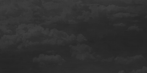 Abstract black watercolor background texture of chaotically mixing puffs of grey smoke on a dark background, beautiful abstract grey cloud on dark black background and colorful texture pattern.