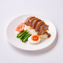 Red pork and crispy pork rice with Chinese sausage and egg on a white plate.